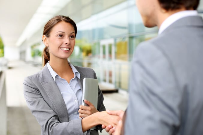 Businesswoman shaking hand to partner.jpeg